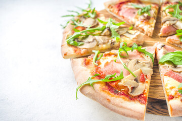 Wall Mural - Pizza party concept.  Set of pizzas with various fillings, Pieces of different pizza, glass and bottle with wine. Flatlay top view copy space on white background