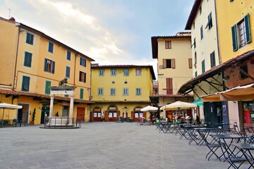 Wall Mural - landscape of the historic Piazza della Sala with the Leoncino well in the historic center of the city of Pistoia in Tuscany, Italy