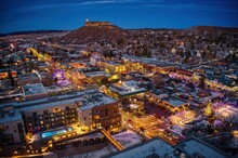 Aerial View Of Castle Rock, Colorado With Christmas Lights At Dusk