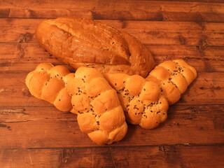 Fresh bread with diapers on a white wooden table