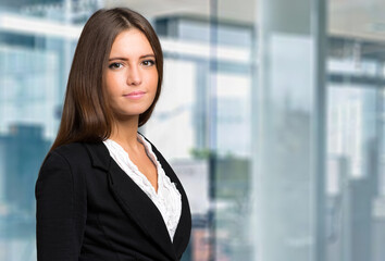 Poster - Smiling young secretary in a modern office