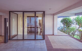 Fototapeta  - modern apartment building entrance glass and metal door, central perspective