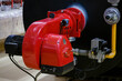Large red gas burner for the steam boiler.