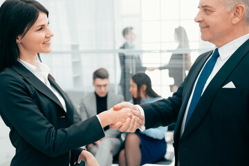 business partners greeting each other with a handshake