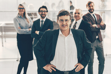 Wall Mural - confident businessman on the background of a business team