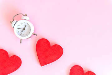 Time for love - Alarm clock and hearts on pink background.Love heart with time clock. time to stay at home concept.Healthy checking plan concept.