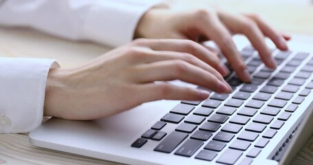 Poster - Woman’s hands typing on laptop keyboard. 4K video