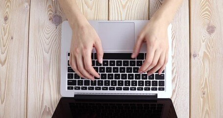 Poster - Woman’s hands typing on laptop keyboard. View from above. Remote work concept image. 4K video