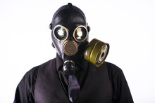 Cosplay Of A Guy In A Gas Mask On A White Background With Glowing Eyes