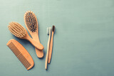 Fototapeta  - Body care with eco-friendly accessories. Bamboo toothbrushes and combs.