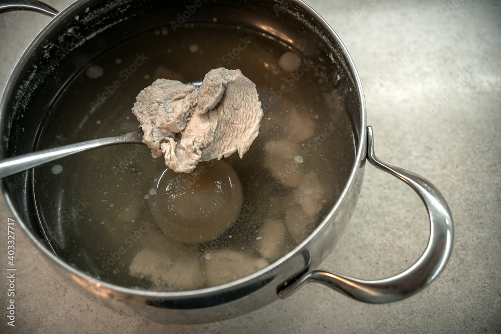 Meat Both Boiled meat on a spoon for patients with gastrointestinal tract. A pot ...