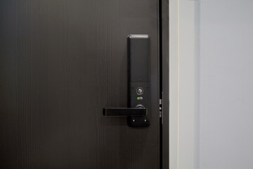 Wall Mural - Digital door lock security systems for access protection of hotel, apartment door. Electronic door handle with key pads numbers. Selective focus