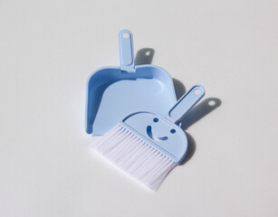 Mini broom and dustpan set isolated white background.