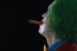 © serikbaib - men in joker mask with cigar