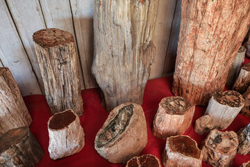 Large petrified wood pieces on display at souvenir market in Antananarivo, Madagascar