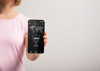Poster - Woman holding and showing smartphone with vpn app