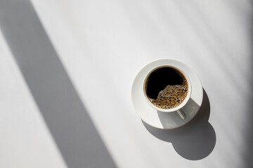 hot coffee on white table background. space for text. top view