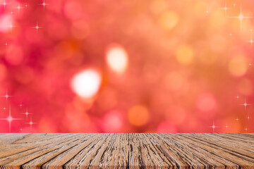 Wall Mural - abstract blur beautiful red color background with star glitter bokeh light and perspective wood to s