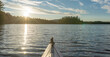 Kayaking during sunset on a pristine Adirondack body of water.  Middle Saranac Lake.