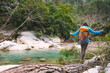 © zhukovvvlad - A girl crosses a river on a log