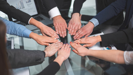 close up. business team making a circle out of their palms