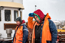 Tired Nordic Fishermen Under Snowing