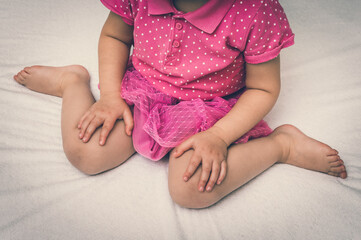 Child sitting in bad position, which is called W-sitting