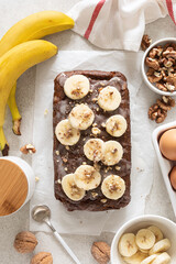 Wall Mural - Banana bread cooking on kitchen table, top view