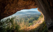 Beautiful view of Nakhon Chum City, nature looking through the cave on the Pok Lon mountain in Thailand.
