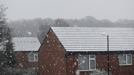 Old brick houses in snow on a winter morning, Coventry, UK