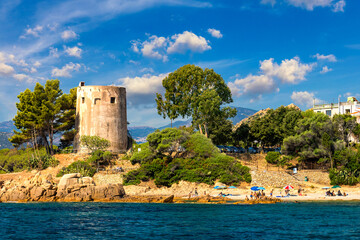 The historic old lighthouse, Santa Maria Navarrese, (Torre di Santa Maria Navarrese) is a popular tourist spot with views across the sea, on the east coast of the island of Sardinia, Italy.