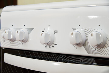 Wall Mural - Control knobs on gas burners stove hob in the kitchen
