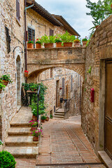 Wall Mural - Narrow alleys and ancient medieval buildings in the picturesque town of Spello, in Umbria (Italy)