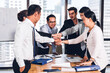 © Art_Photo - Successful of group professional business people to win of celebrating project success.Creative business putting and joining their hands good teamwork together with graph analyze on table