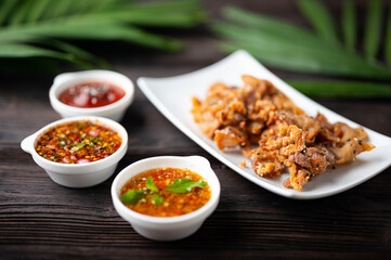 Wall Mural - Crispy fried sliced belly pork with spicy sauce