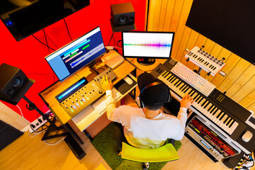 Wall Mural - top view of professional music producer arranging, mixing a song in sound studio