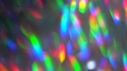 Wall Mural - Rainbow refraction of light. Neon pink blue purple silver crystal lights bokeh. Luxury background for a party. Blurred holographic holiday lights