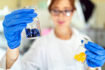 Wall Mural - Woman student, scientist of chemistry working in laboratory