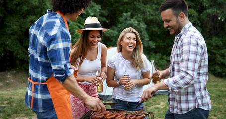 Friends having a barbecue party in nature