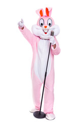 Wall Mural - Funny crazy singer Easter bunny or rabbit sings in retro vintage microphone, celebrates easter, dances isolated on white background. Happy musician, rabbit or hare having fun