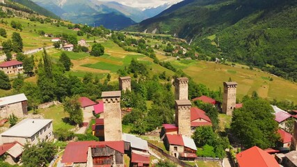 Wall Mural - Aerial tilt down view of Svaneti towers in Mestia,Svaneti. Historical sightseeing destination in Georgia