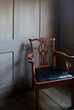 © Arcaid Images - Period armchair in corner of room