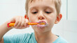 © Kyrylo Ryzhov - Portrait of funny toddler boy cleaning and brushing teeth at morning. Concept of teeth hygiene and child healthcare