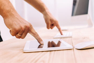 Wall Mural - close up. man pointing at digital tablet screens.