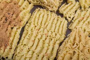 Wall Mural - dried instant noodles, isolated on gray background.