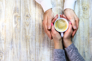 Wall Mural - The lovers drink coffee together. Selective focus.