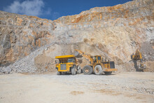 Loader Loading Mining Truck At Open Pit