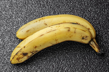 two old bananas with black dots