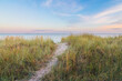 © Anselm - sand path trough the dunes towards the ocean under the beautiful sunset sky