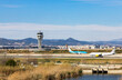 © Cavan - Landing strip at Barcelona airport with planes on the runway